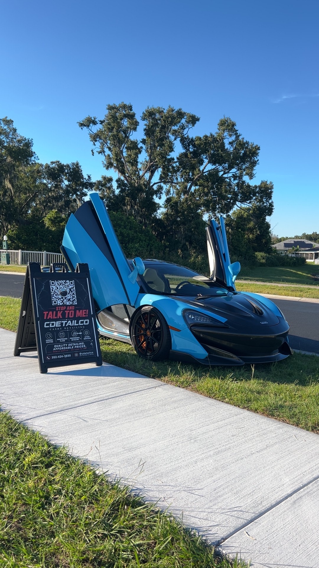McLaren with butterfly doors after a premium detail